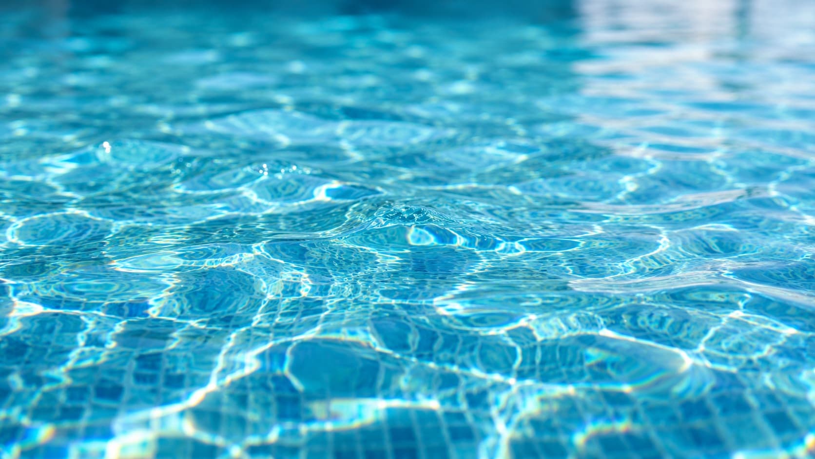 Close-up of crystal-clear turquoise pool water