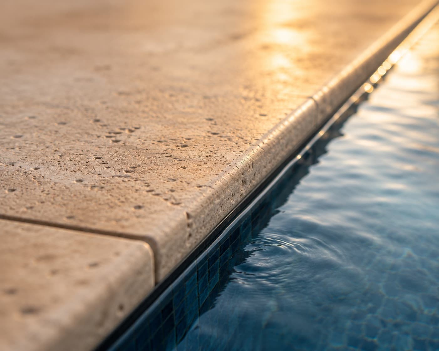 Natural stone pool coping detail — Al Kahaf craftsmanship.