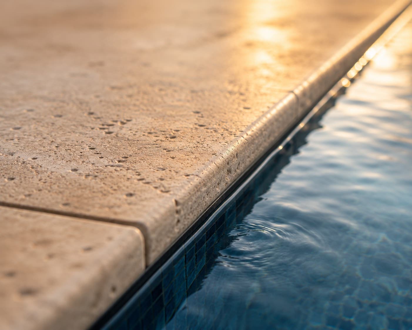 Natural stone pool coping detail — Al Kahaf craftsmanship.